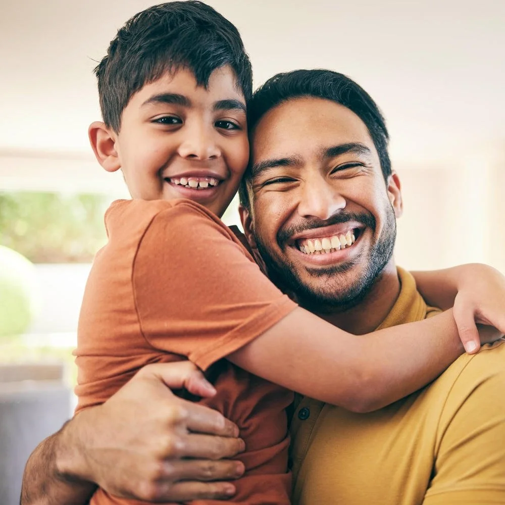 Happy father and son hugging