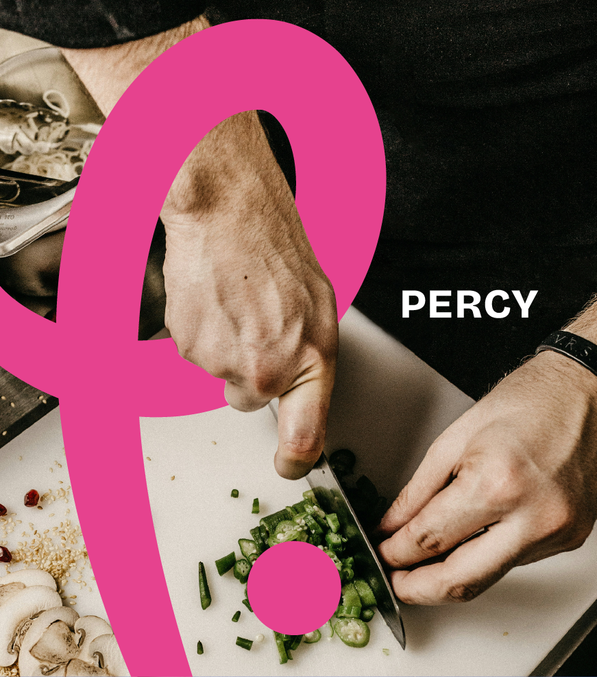 A person chopping green onions with a knife on a white cutting board. There are sliced mushrooms and other ingredients nearby. The person's hands are visible, wearing a black wristband and black shirt. Large pink letter 'Q' overlayed on the image with the name 'Percy' in white text.