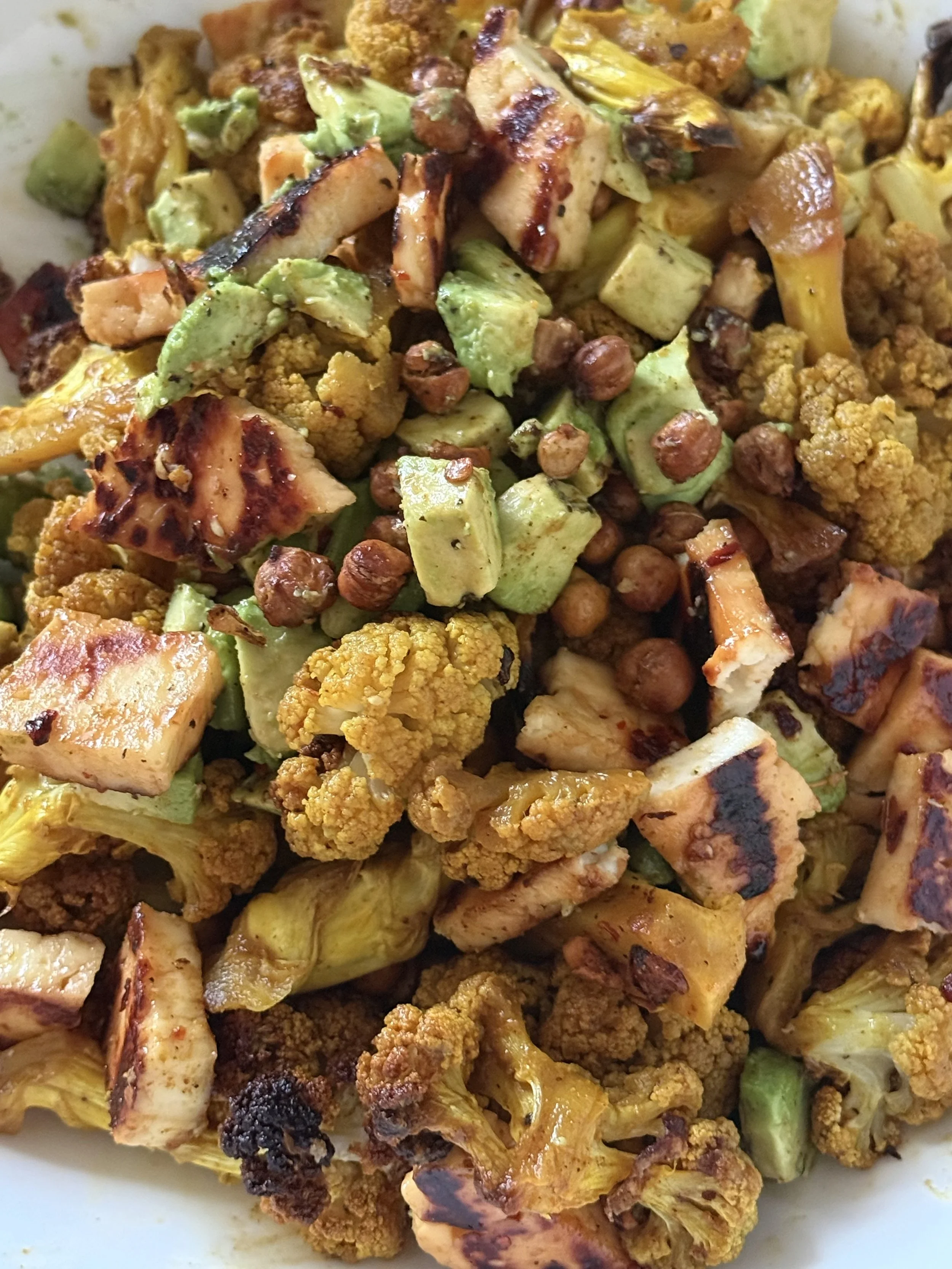 Roasted Spiced Cauliflower Salad with Crispy chickpeas, Avocado and Halloumi