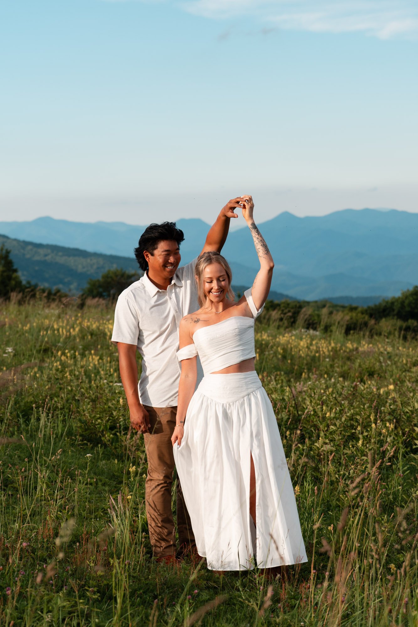Couple dancing at Max Patch during engagement session
