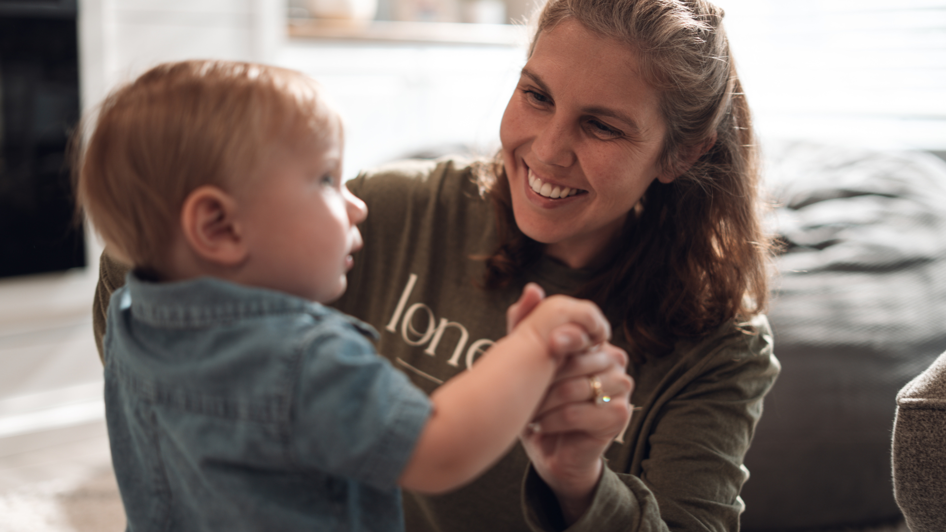 Nanny and little boy playing