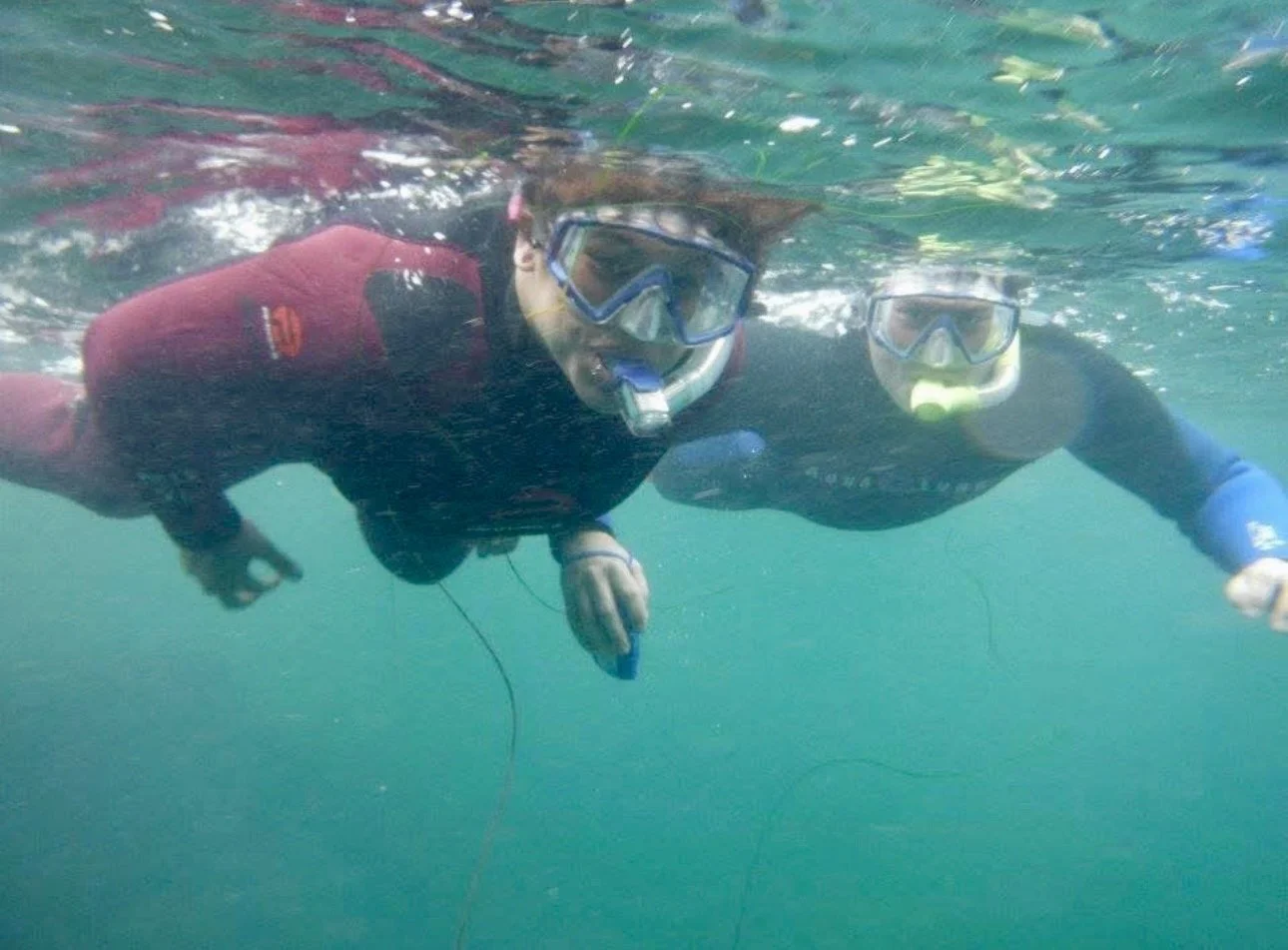 Two people on a snorkel tour in San Diego at La Jolla Cove with Scuba with Justin.