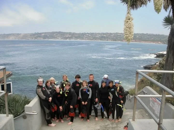 Group posing before a La Jolla cove snorkel tour in San Diego