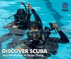 Scuba instructor practicing dive skills in the pool in San Diego with student who wanted to try scuba.