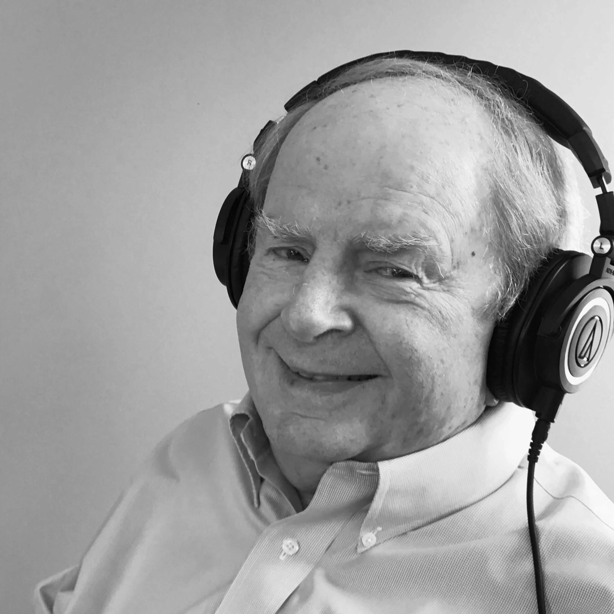 Howard Stevenson smiling with headphones on