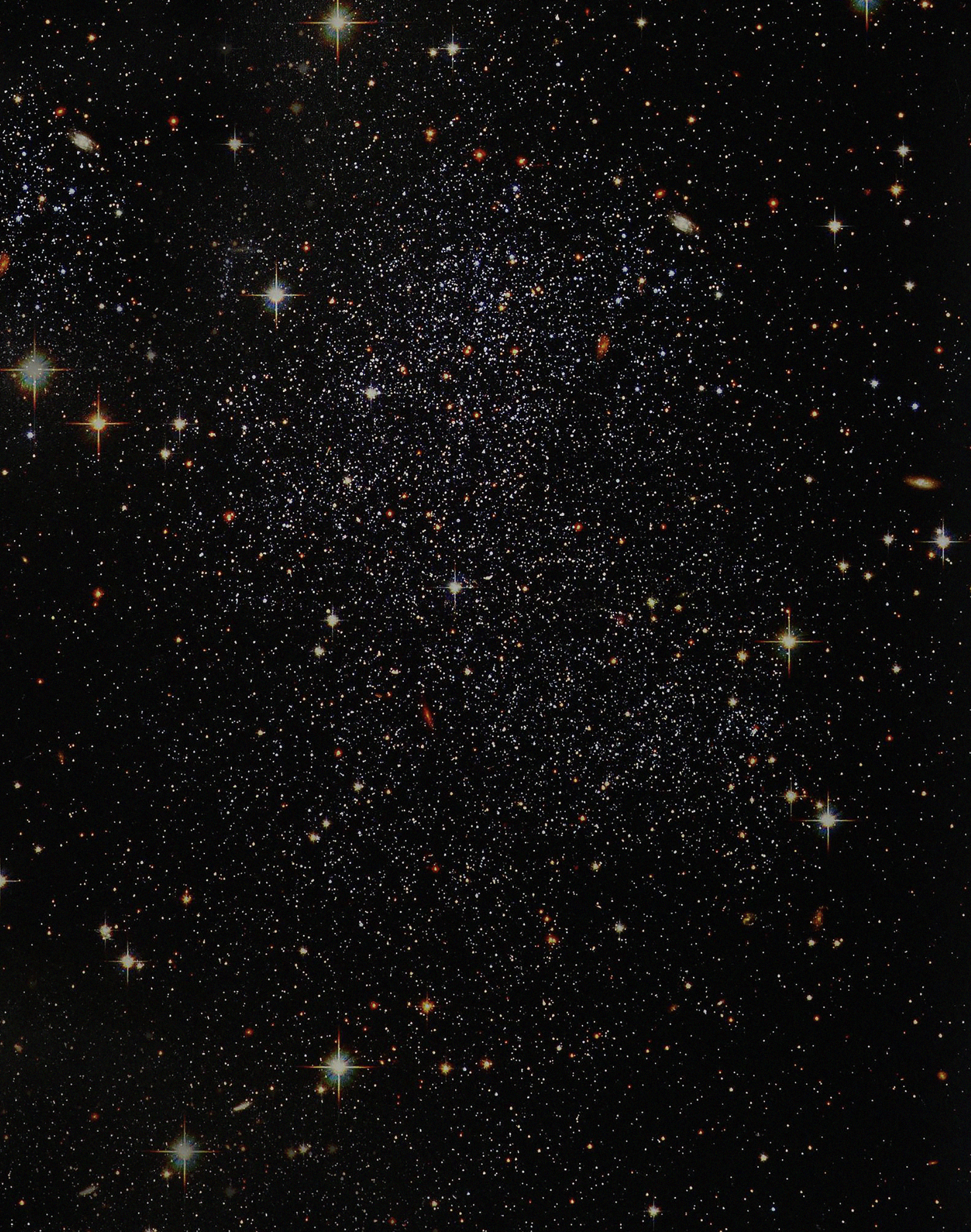 An oval photo of the stars in the universe