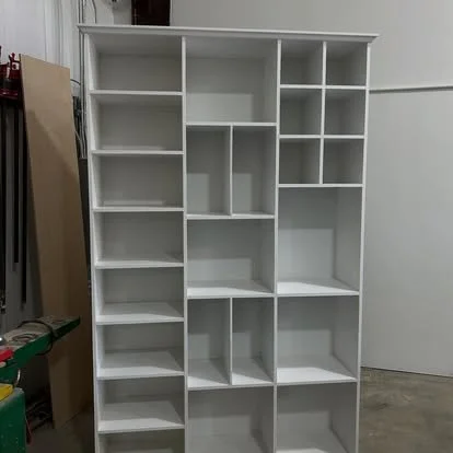 Wood shelving built in to store accessories and purses. Built in purse storage.