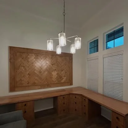 Solid Maple and alder built in desk with custom drawers. The drawer fronts have a chevron design that looks very custom. corner desk cabinet for the L shaped desk