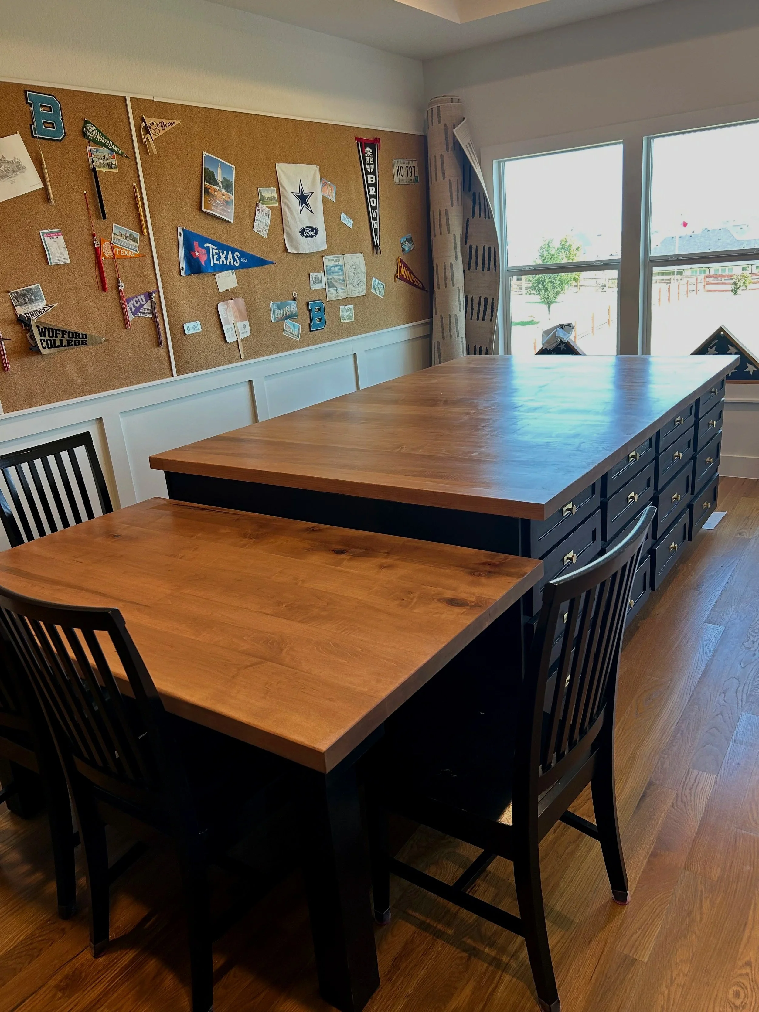 Craft room island and table. black craft cabinets and a solid wood maple top on the island and on the table