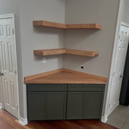 Corner bar cabinet and corner floating shelves. Green corner cabinet, with solid maple  counter top and floating shelves.