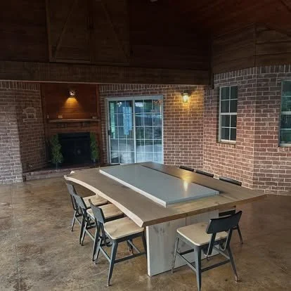 Exterior patio table. Light solid wood pine patio dining table with inset granite. Stone and solid wood porch, outside table. Custom solid wood table for outdoor living.