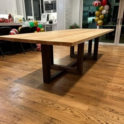 Solid maple wood table with a light top and dark wood table base.Solid wood furniture in argyle texas