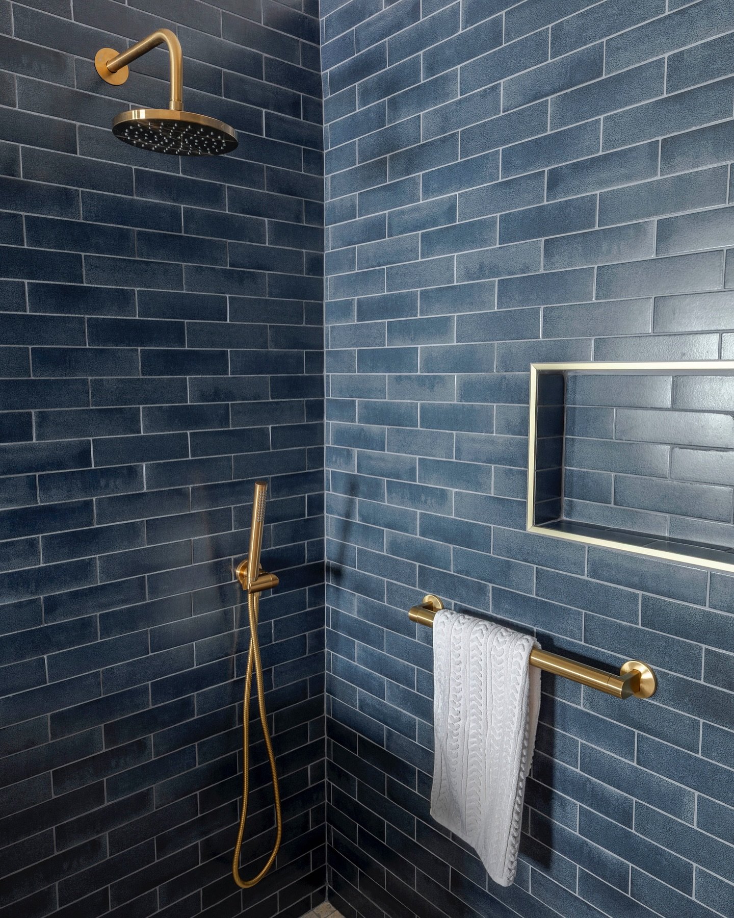 Some spaces just know how to make an entrance. 

Wrapped in bold blue tile with a touch of gold, this shower isn&rsquo;t here to blend in. It&rsquo;s a statement, a vibe, and a little reminder that design should make you feel something. 
  It&rsquo;s