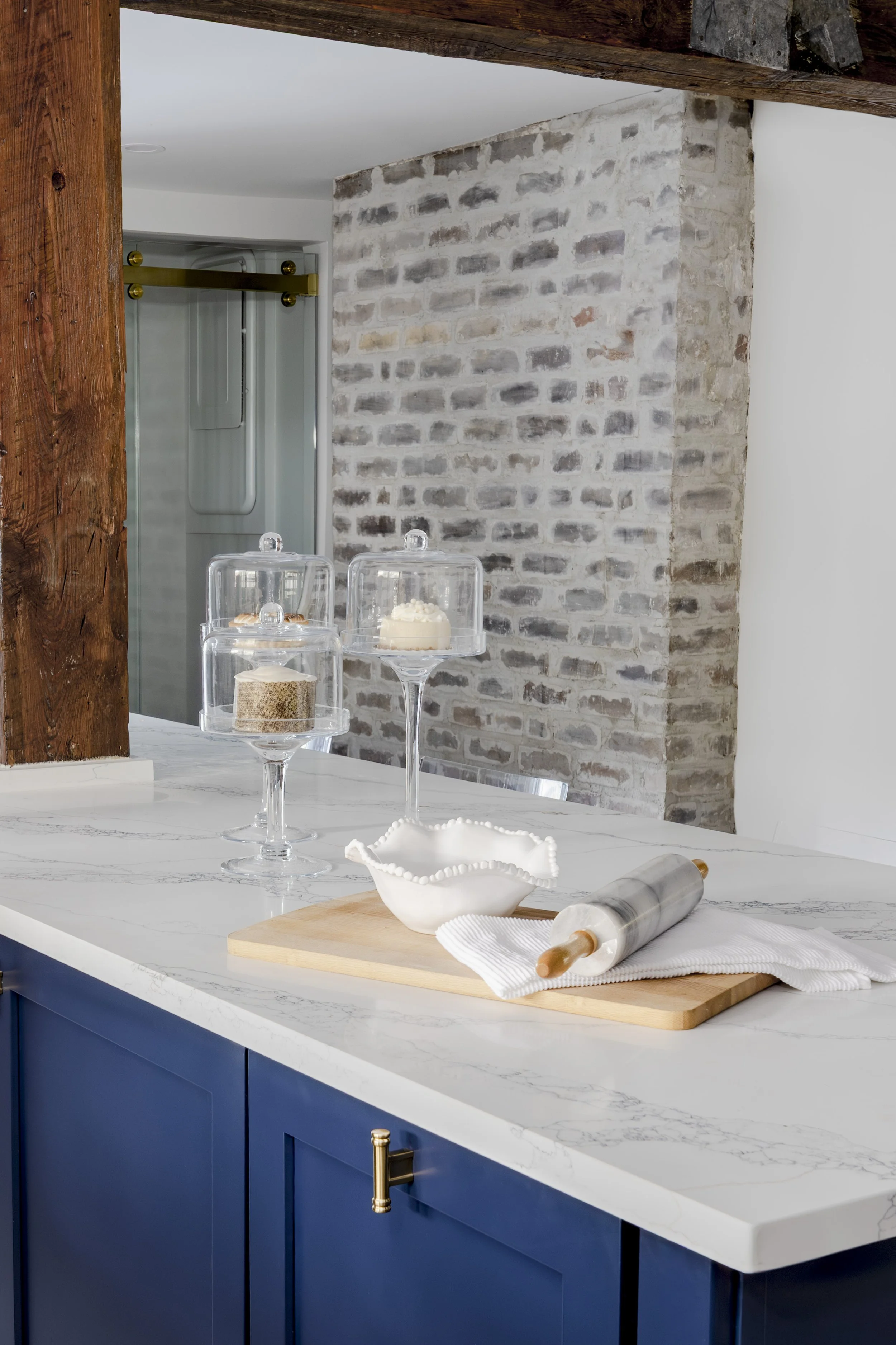 Baking island with marble rolling pin and glass cake stands