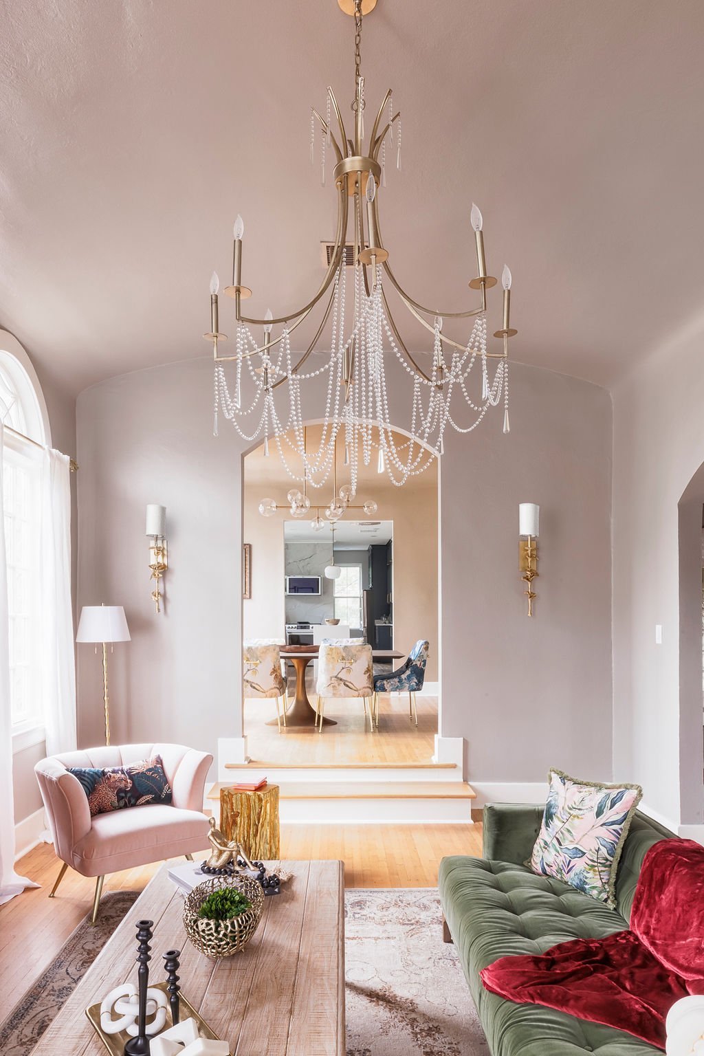 Living room chandelier and arched doorway