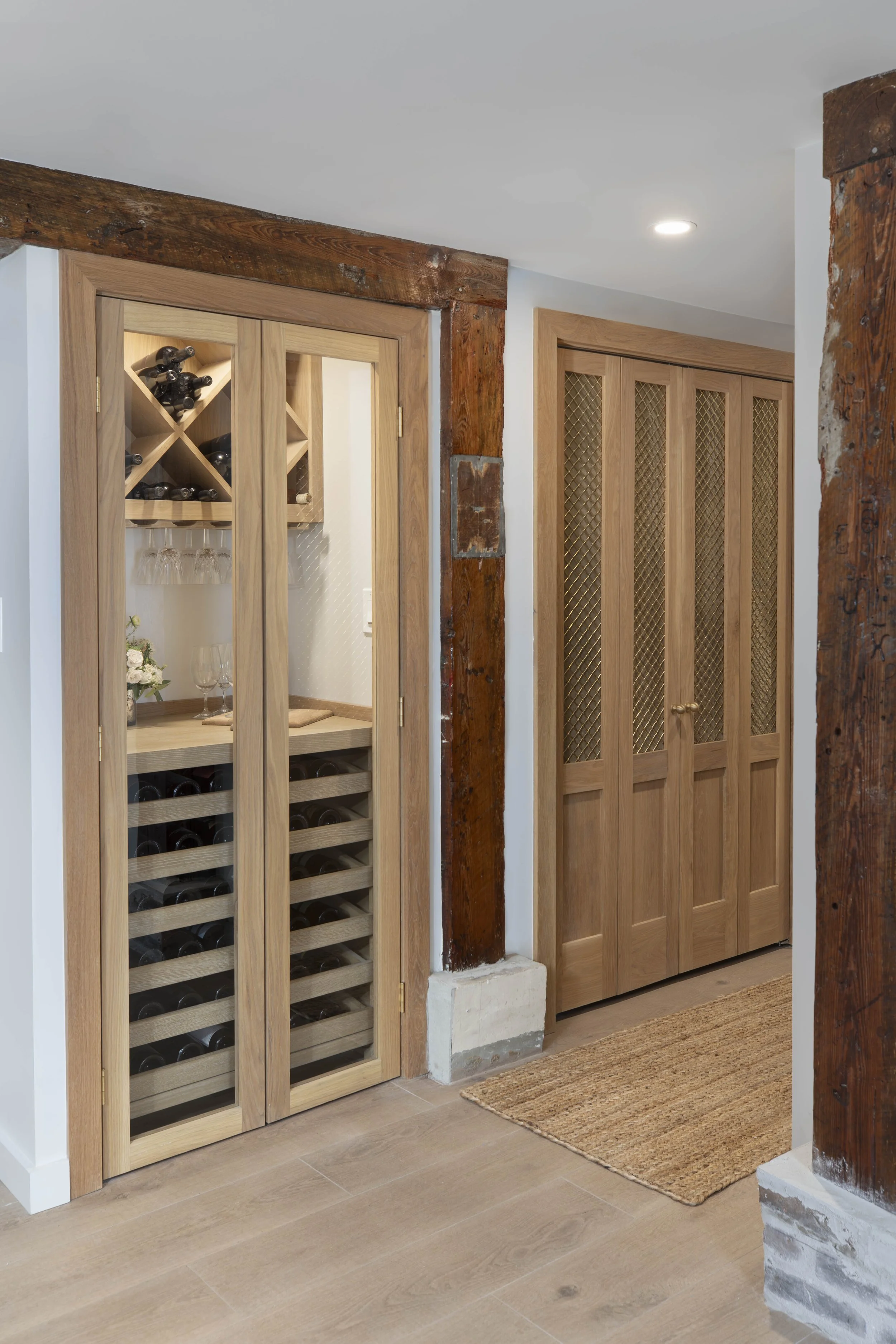 Custom millwork wine cabinet and storage built from detailed design planning in New Orleans home