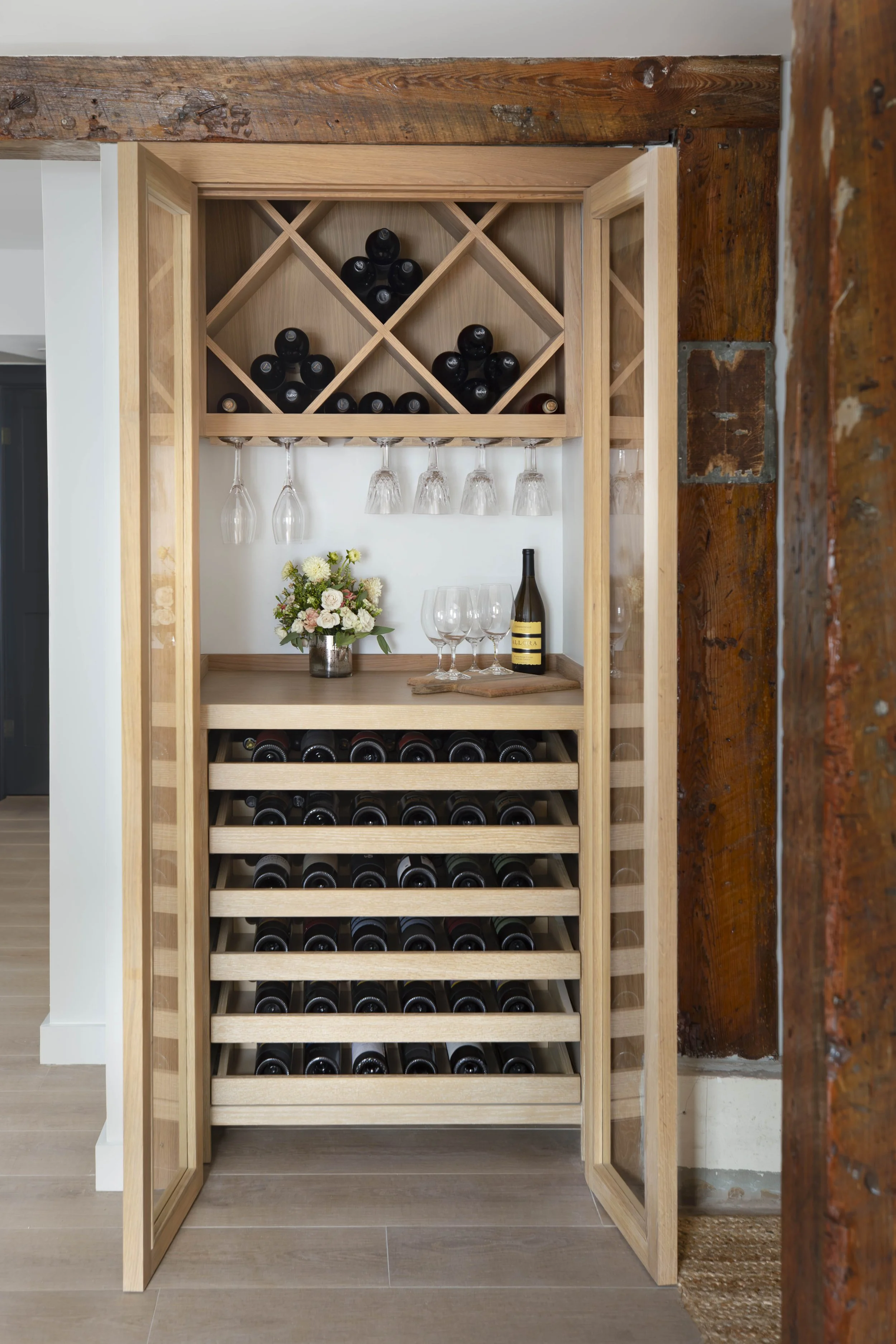 White oak wine closet with diamond bins and pull-out trays
