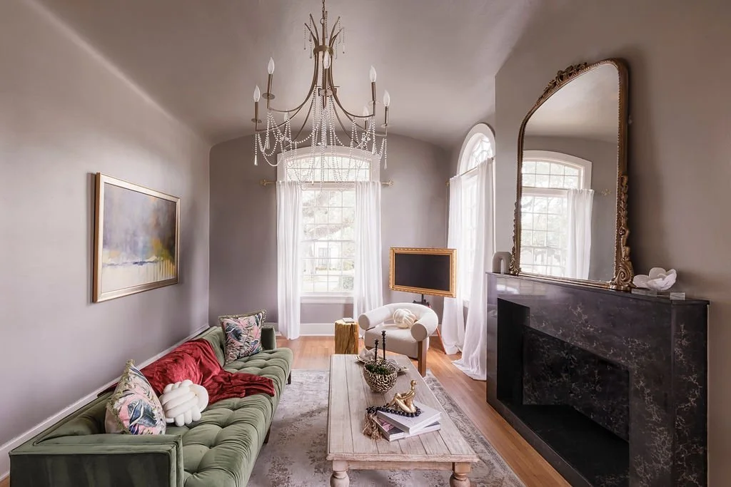 Living room with green velvet sofa