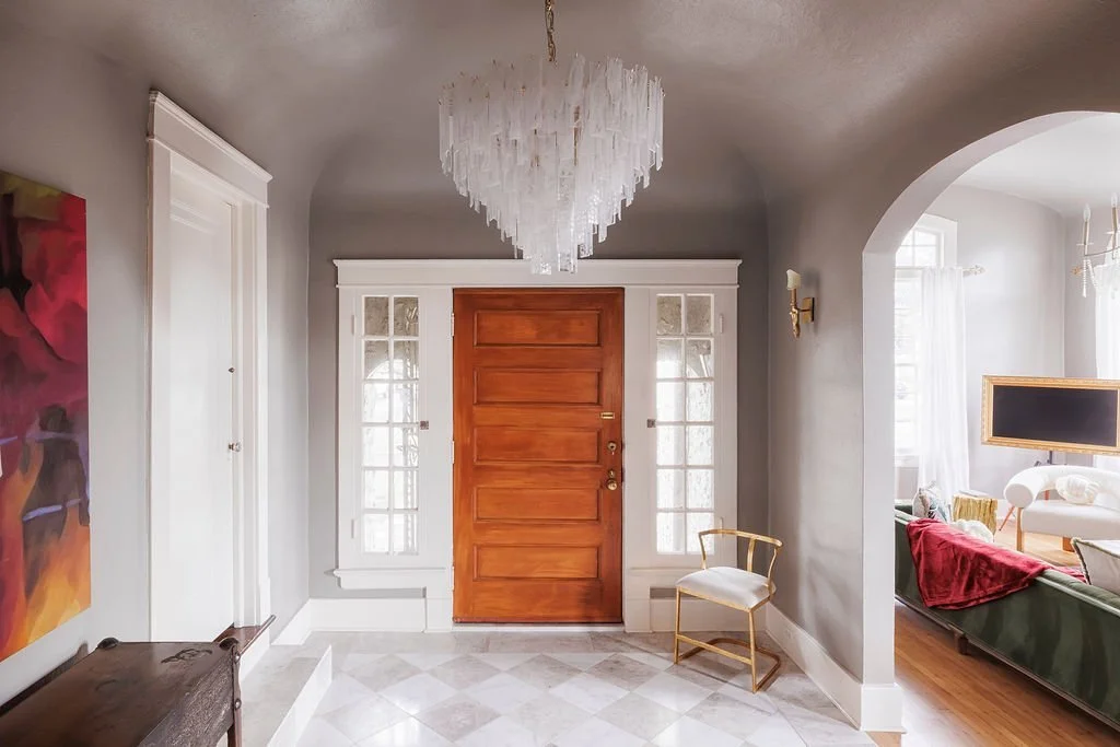 Entry hall with original wood front door