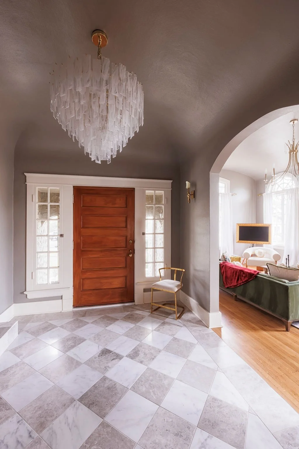 Foyer with checkerboard marble floor