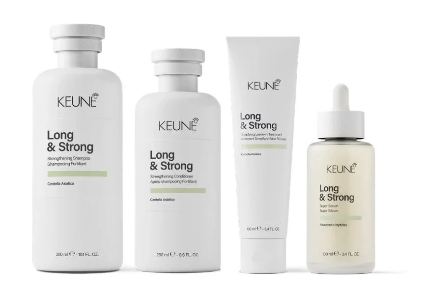 Quatre produits capillaires de la gamme Long & Strong, comprenant un shampoing, un après-shampoing, un traitement, et un sérum, avec des flacons blancs et un design épuré.