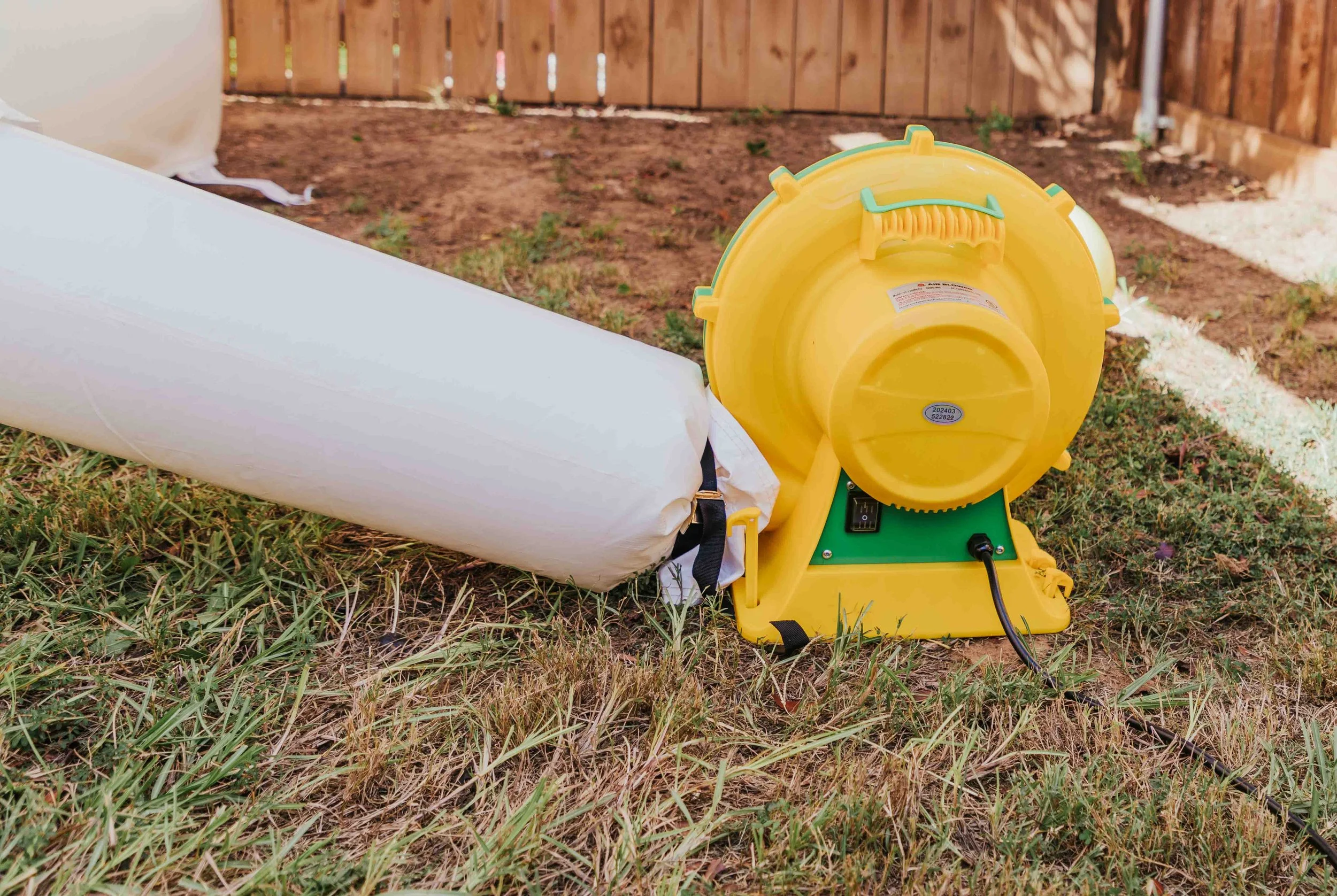 Bounce House Blower blowing into a bounce house