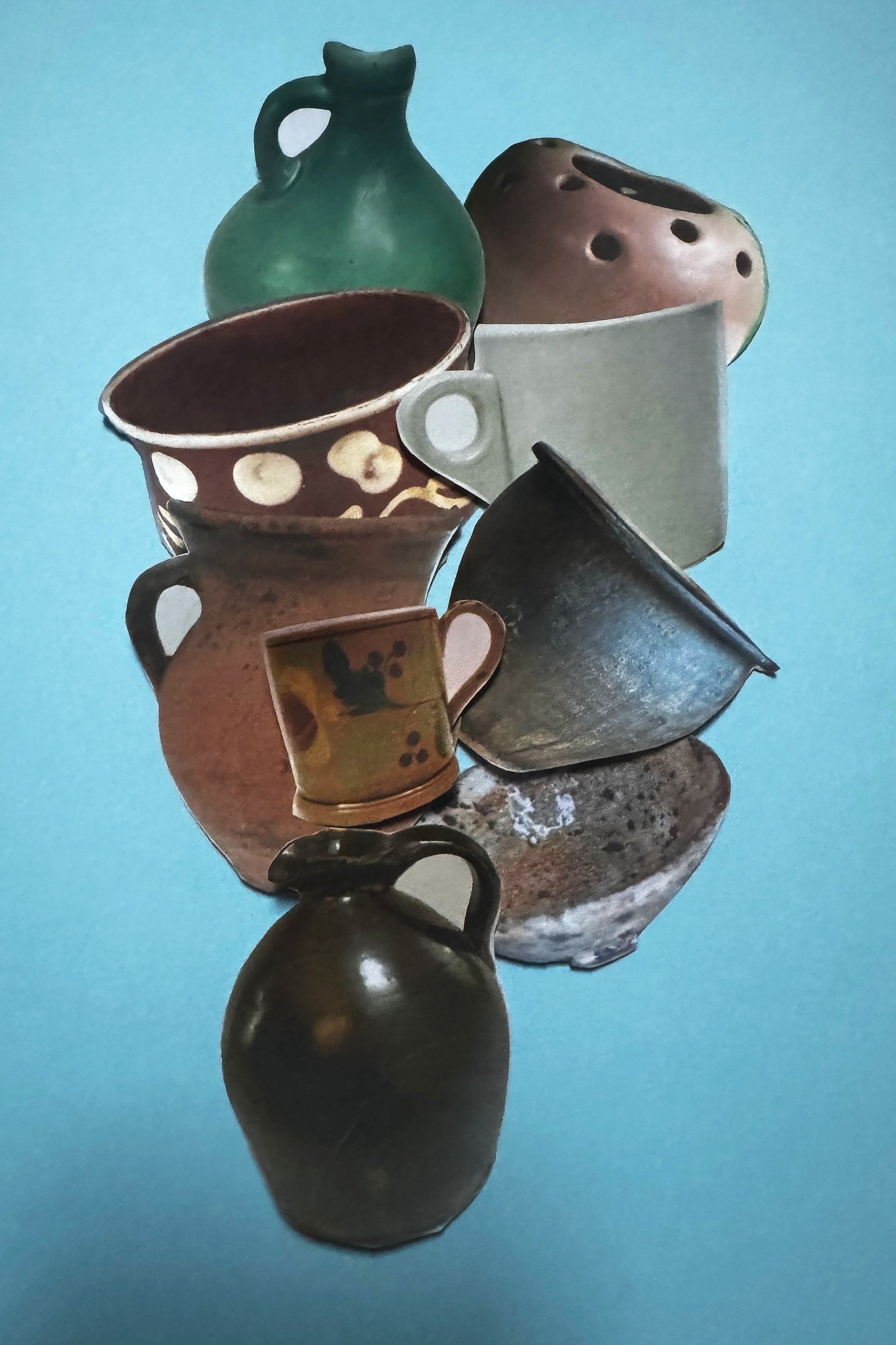 Collection of antique pottery and vessels arranged against a bright blue background.