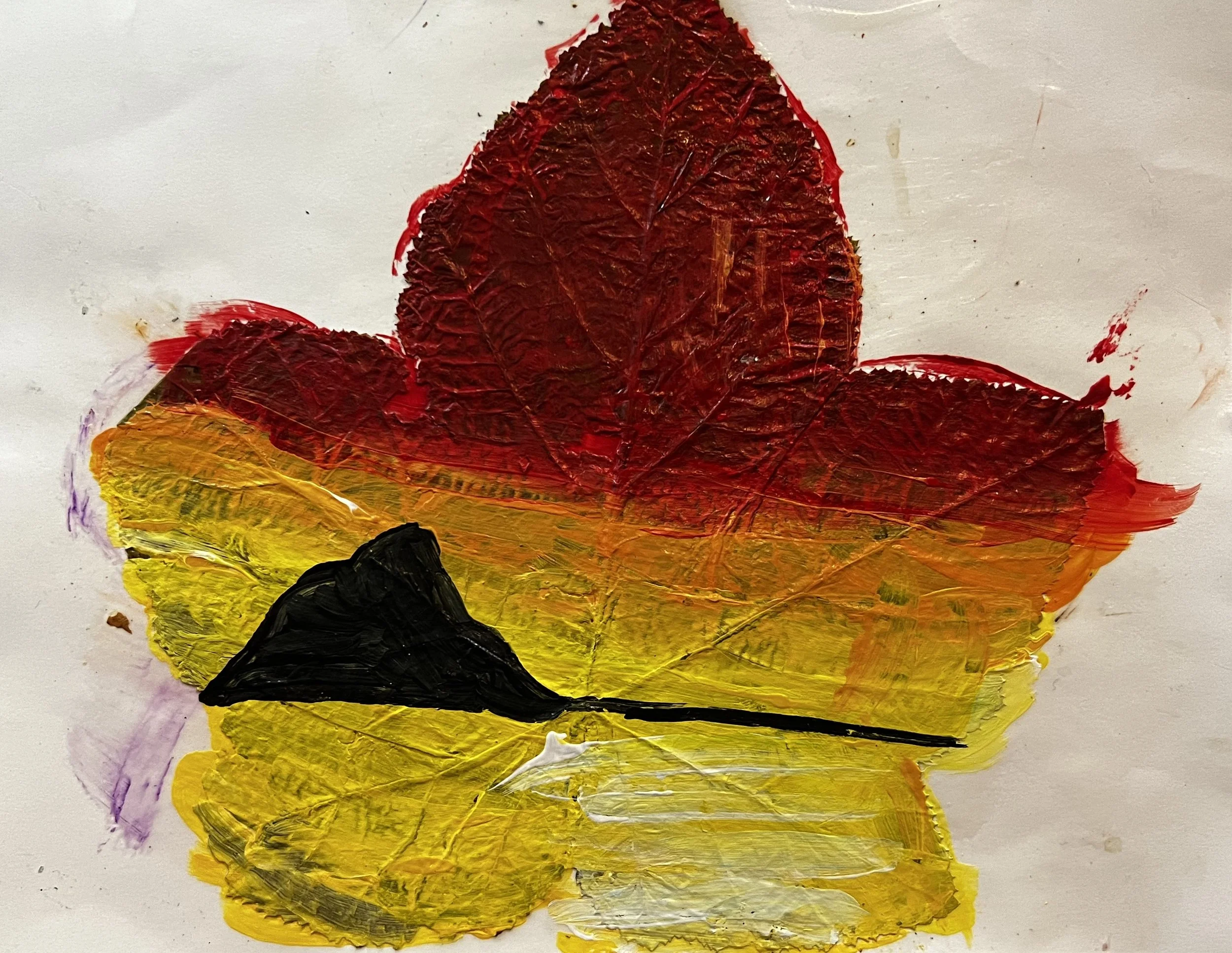 Sunset landscap painted onto a maple leaf