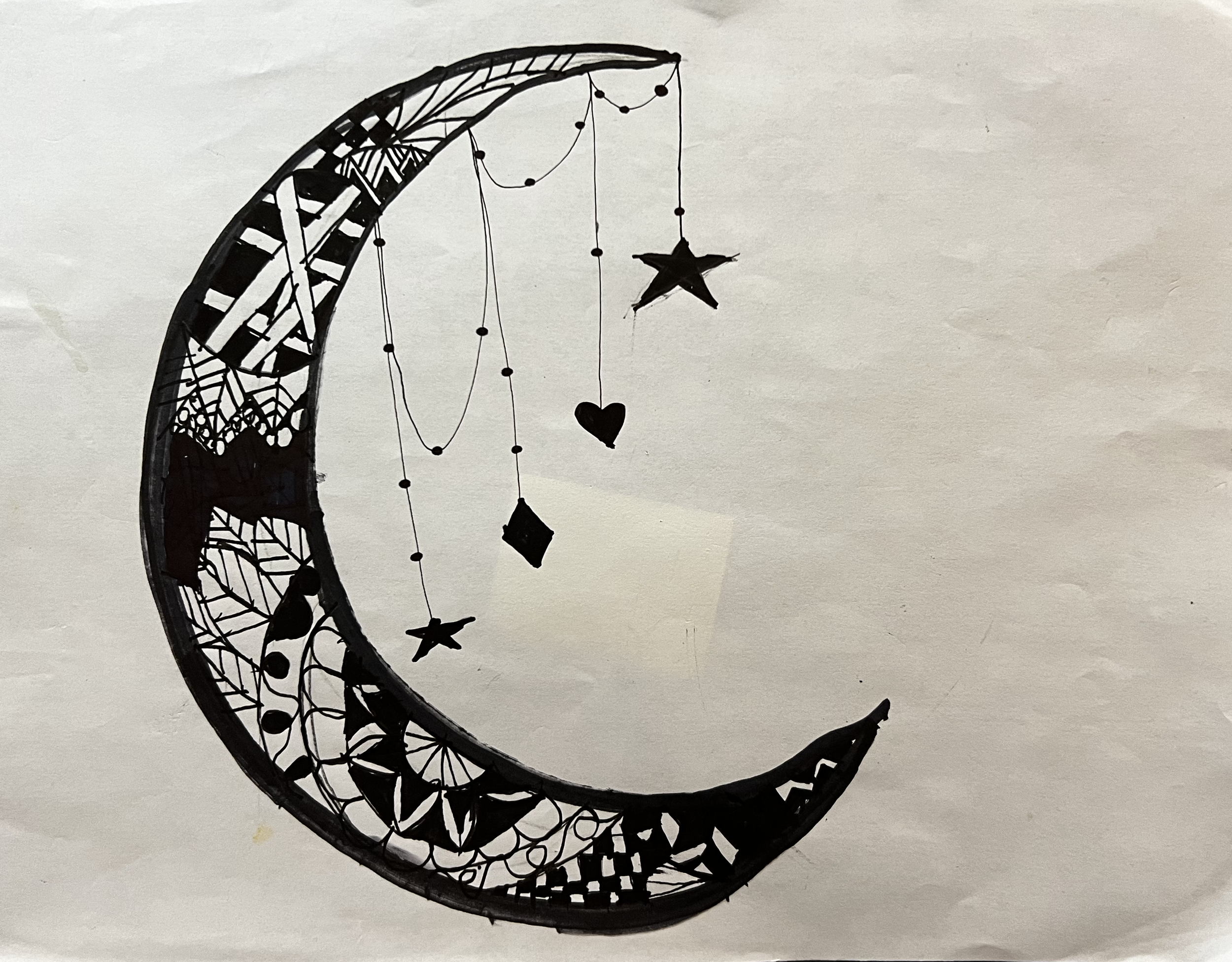 Design filled crescent moon, with stars, a heart, and a diamond hanging from its upper horn