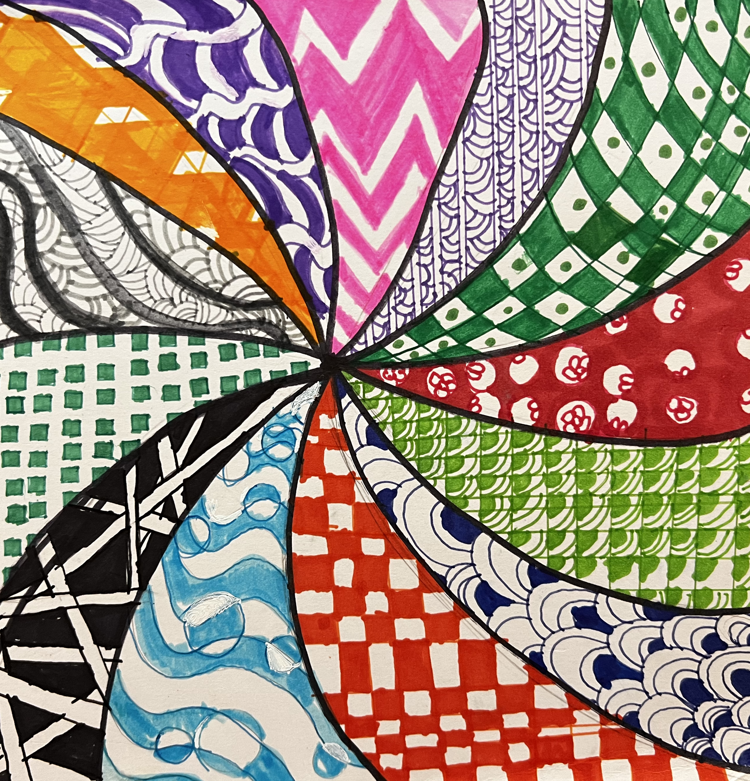 Spiral arms divide different sections of brightly colored patterns