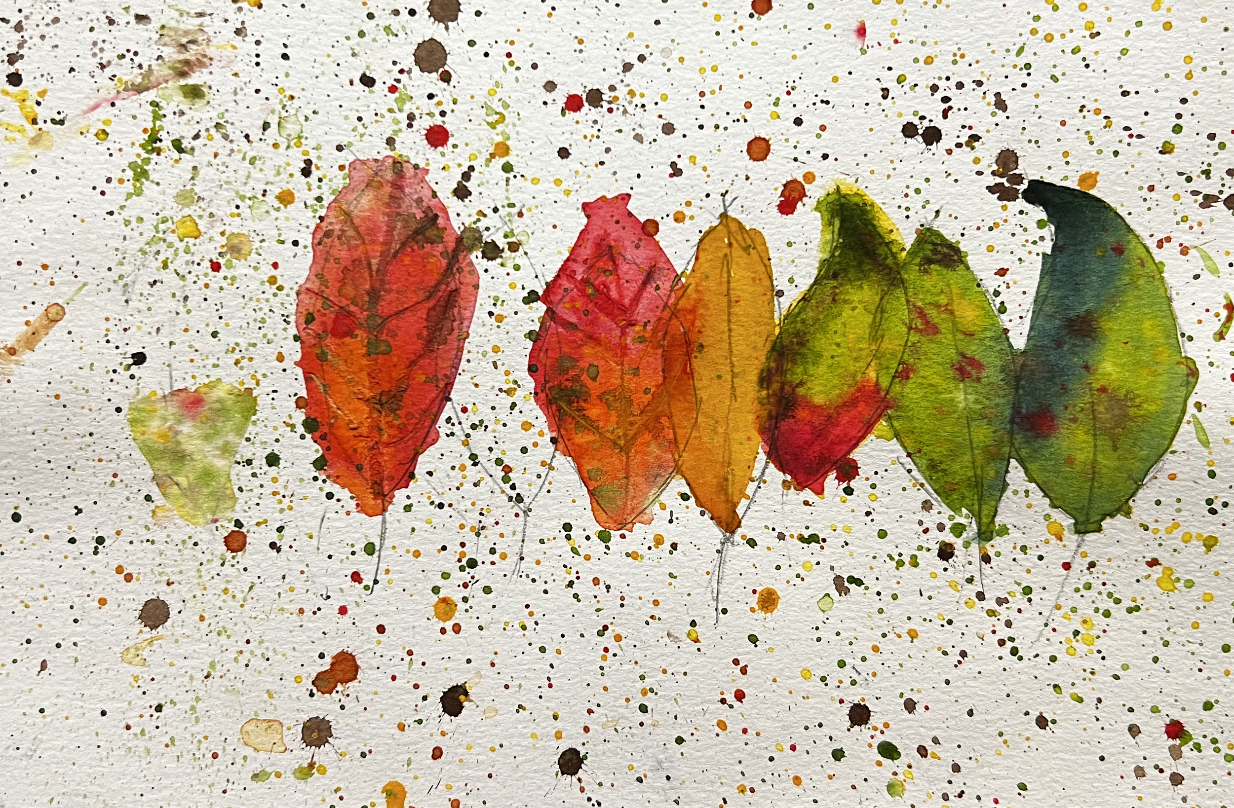 Red orange and geen leaves on a splattered background