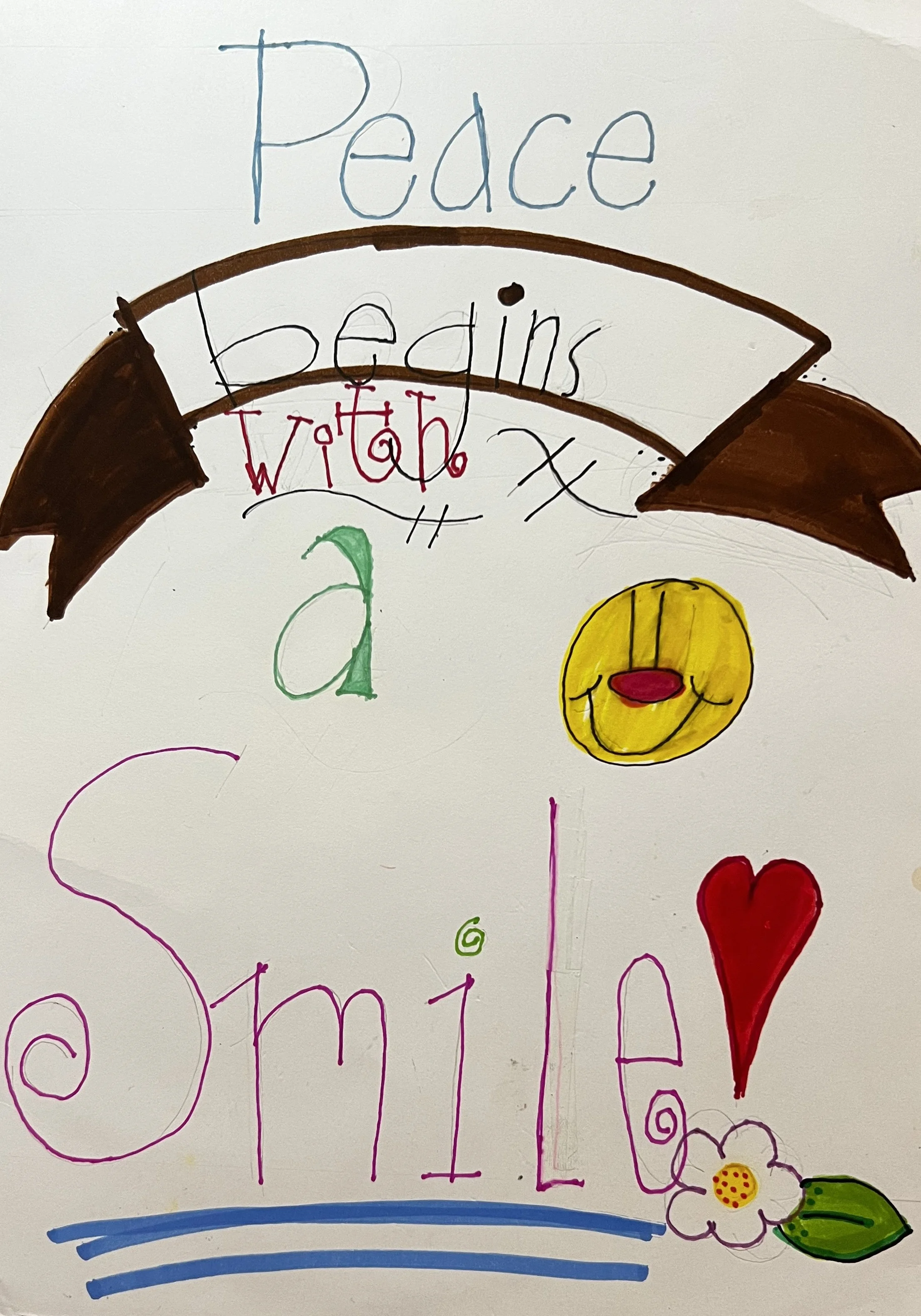 "Peace begins with a smile" decorated with flowers, a heart, and a smiley face