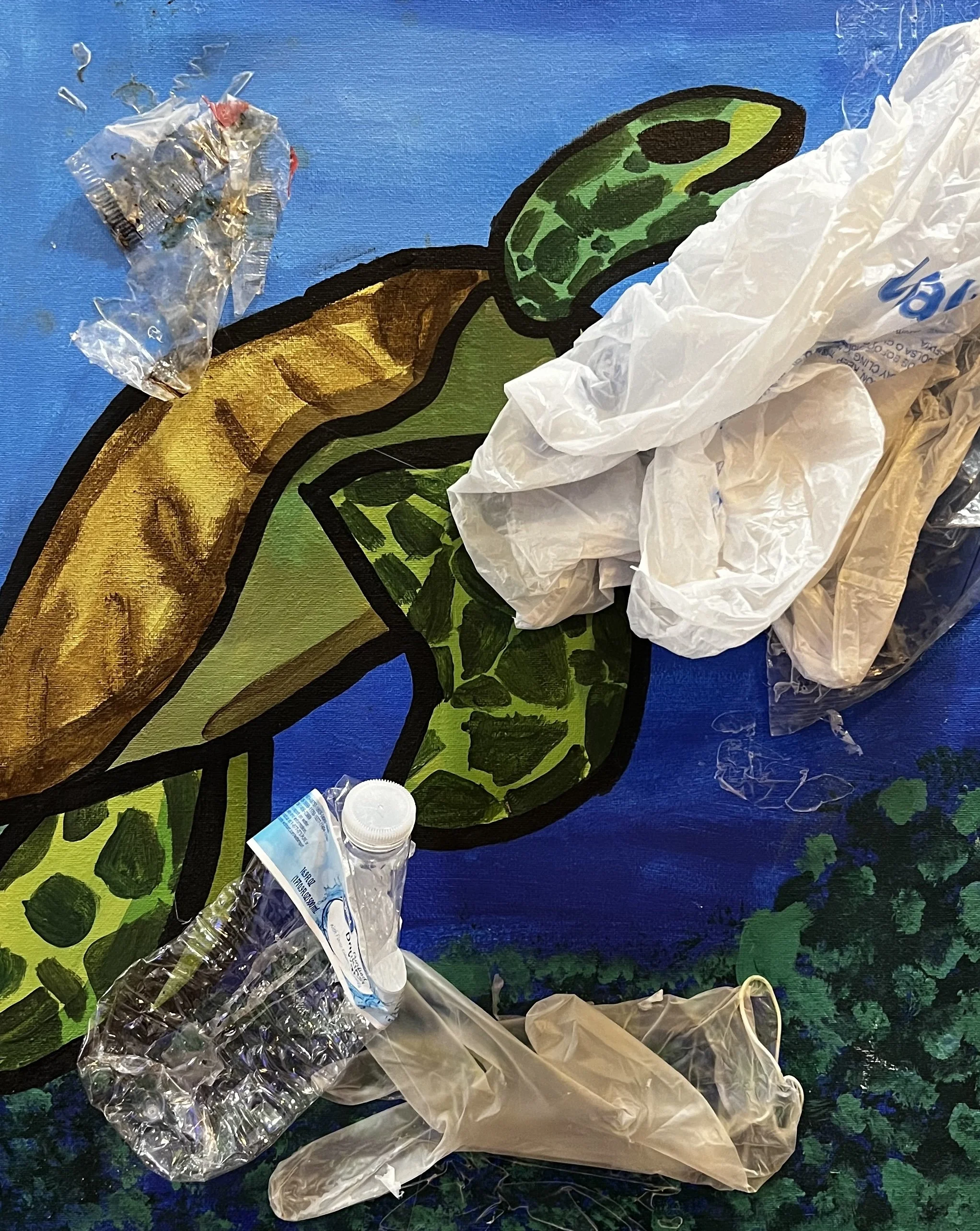 Plastic Bags and bottles add 3 dimensionality to a painting of a turtle