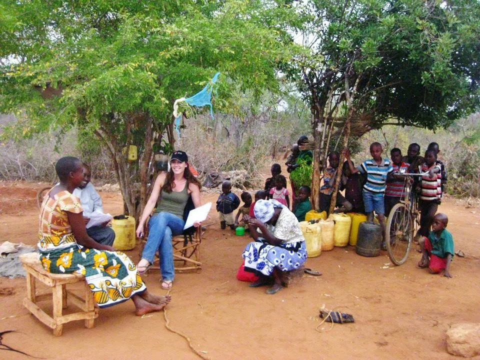 Photo of Dr Tara Rava Zolnikov working in Kisumu Kenya on HIV AIDS research and interventions in AID affected community with the Kenya Red Cross