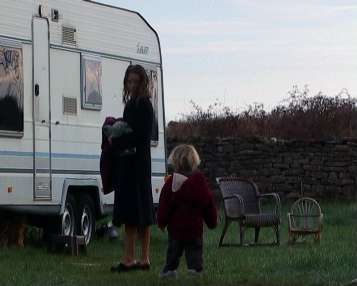 A and S in front of caravan.png