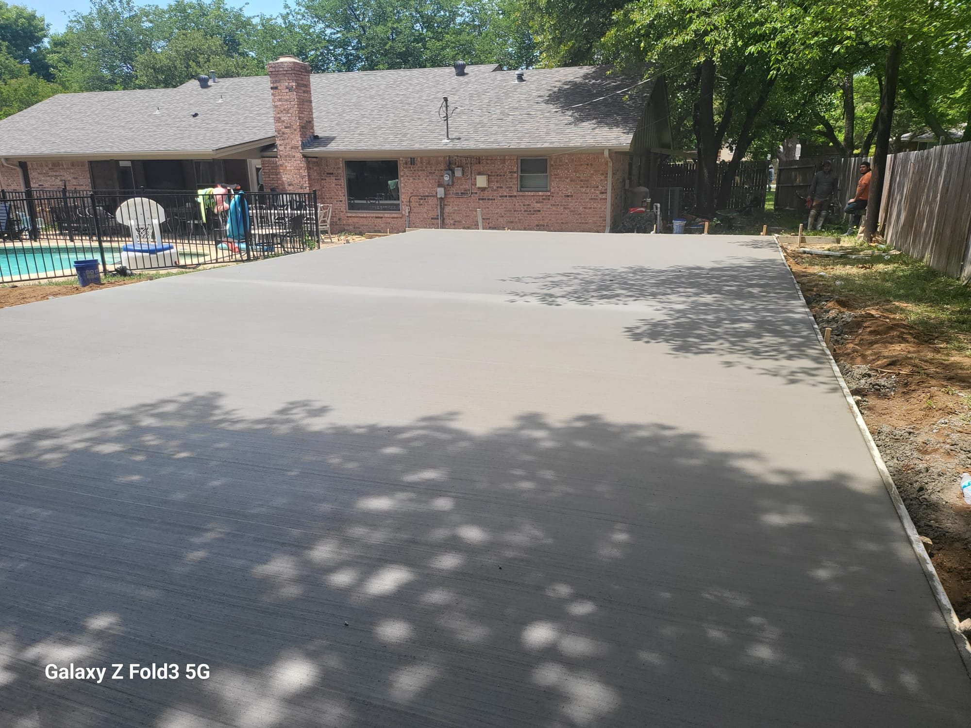 Oranssi technician working on a roof project