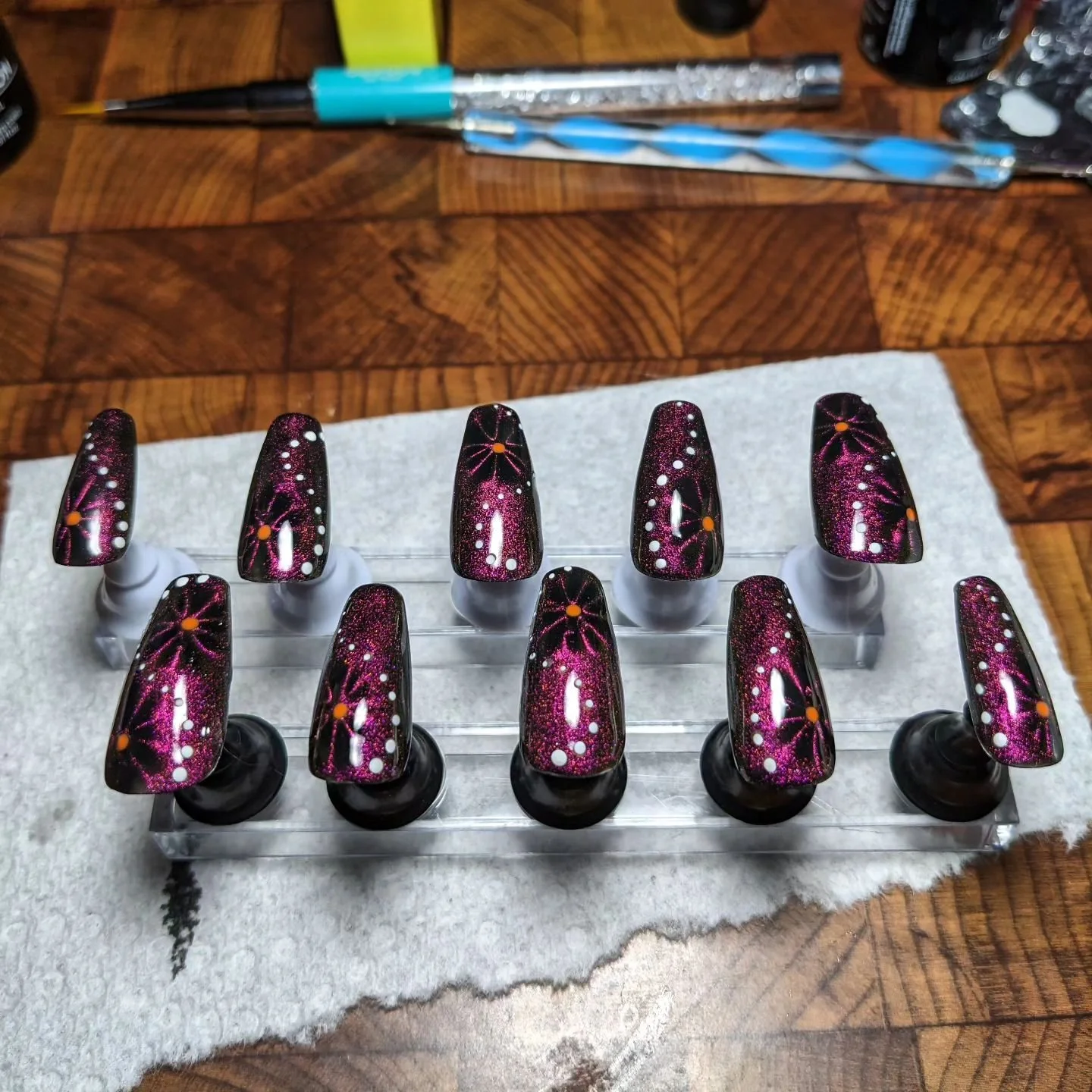 First set of press on nails I experimented with! Definitely a learning curve, but so nice to be able to work at any angle I need. Cat eye polish is one of my favorites 😎 and dot work is my specialty 💅
. 
.
.
#sascustomnailart #nailart #pressonnails
