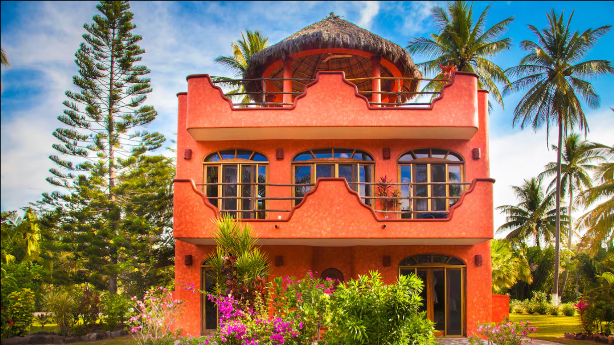 Orange house with view of the ocean
