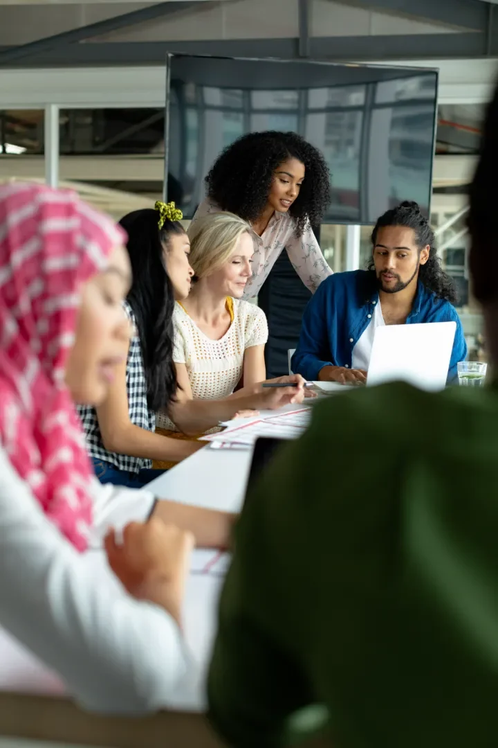 Group of office workers in a meeting collaborating
