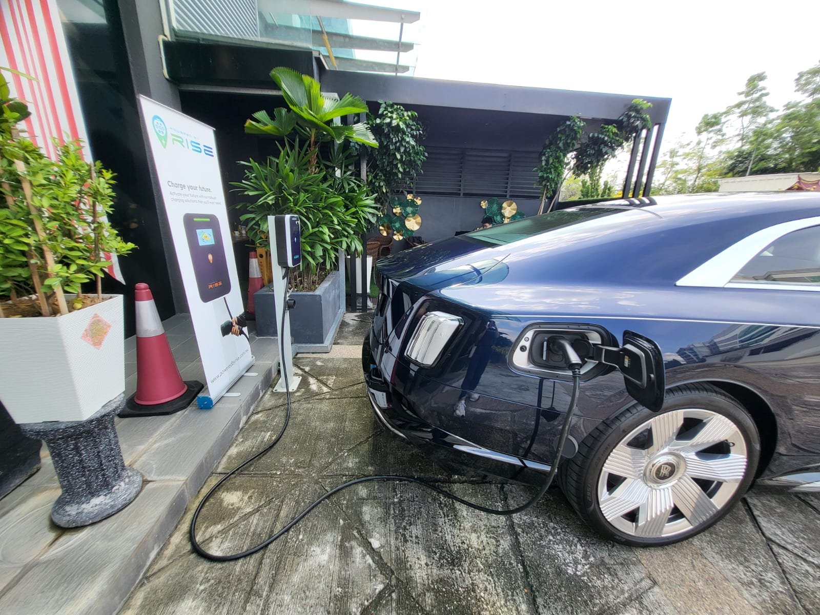 Powered by RISE EV charging station installed at Cohiba Atmosphere parking bay.