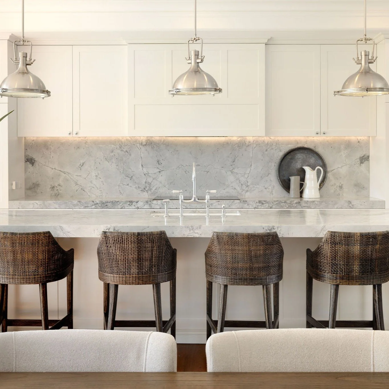 A kitchen renovation is never just about the kitchen &mdash; it's about how a family gathers, cooks and lives.

This home came to us with dated white cabinetry that no longer worked for the way our clients live. We reimagined it from the ground up: a