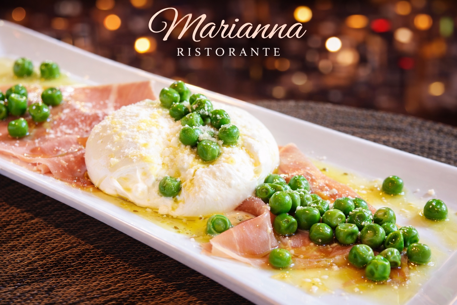 A white rectangular plate with sliced cured ham, a poached egg, green peas, and grated cheese, garnished with olive oil and herbs, served at Marianna Ristorante with a blurred background.