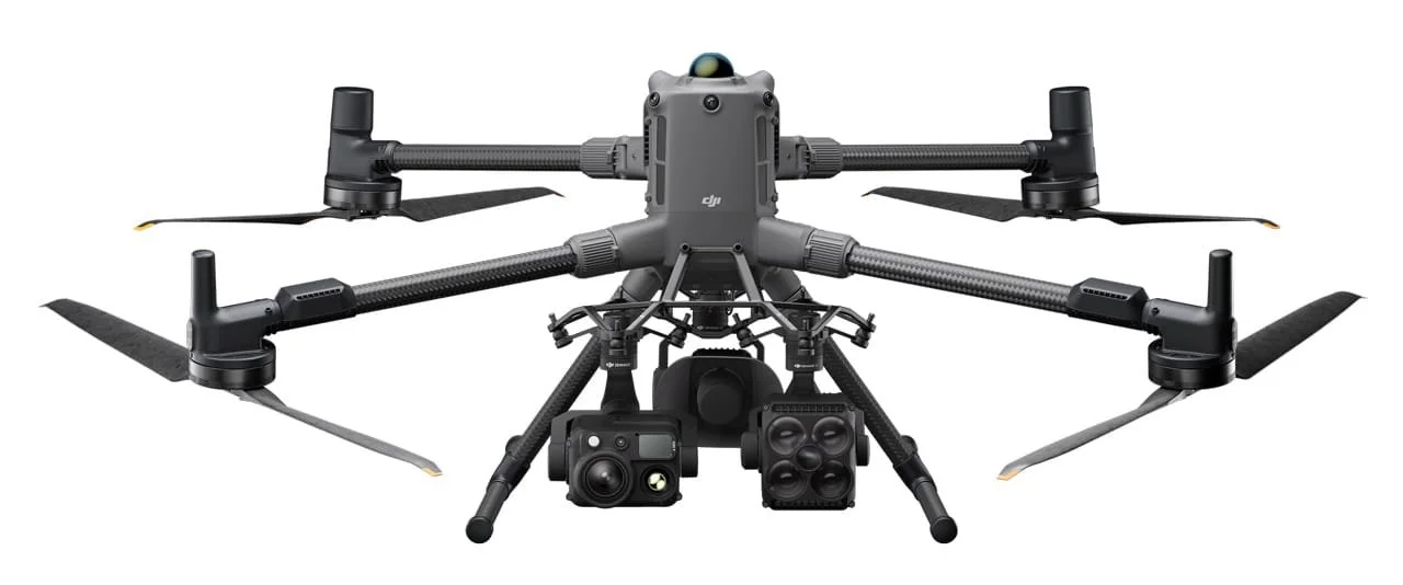 A professional drone with six propellers, a camera, and additional equipment mounted underneath.