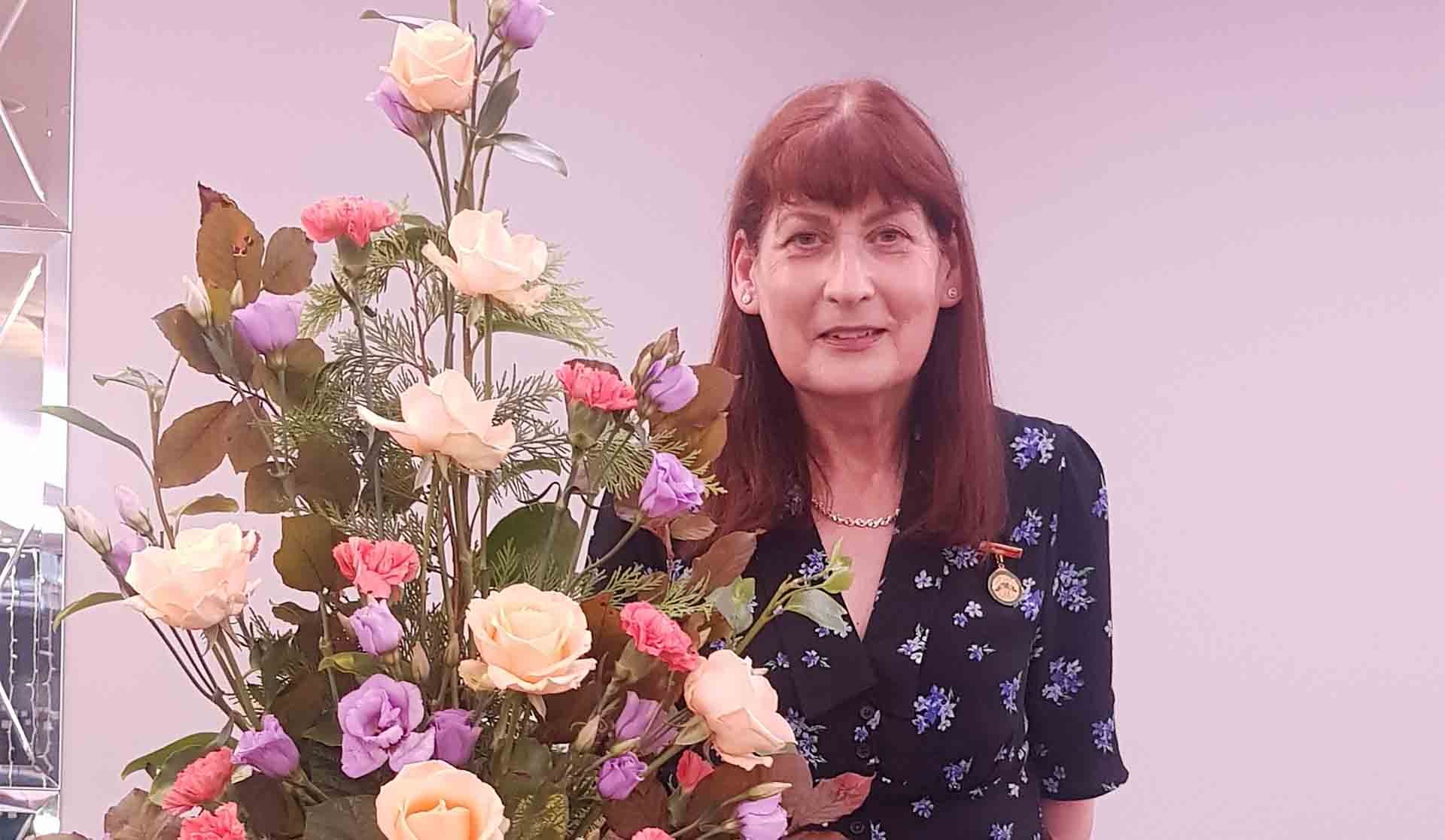 Photo of beautiful flora art bouquet with  Presenter Elizabeth Murray AOIFA.