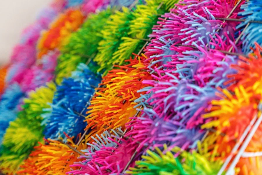 Close up of hundreds of sensory balls all colours of the rainbow