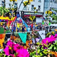 Clourful flags and a street full of people enjoying the festivities of last years JuneFest in Newbridge Co Kildare