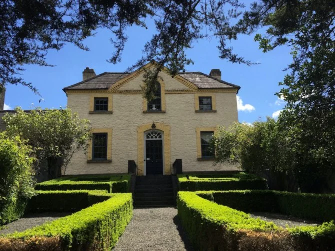Photo of Kildrought House with maze garden in front