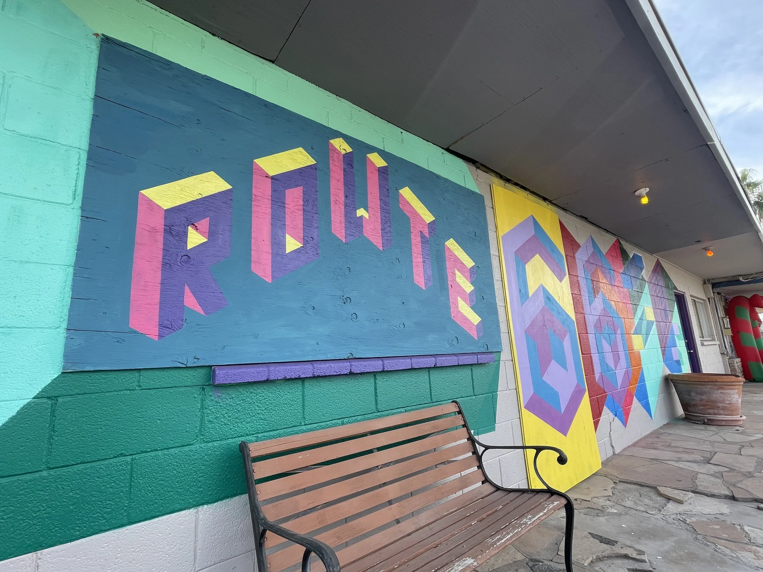 Route 66 mural, geometric graffiti, remodel of resort