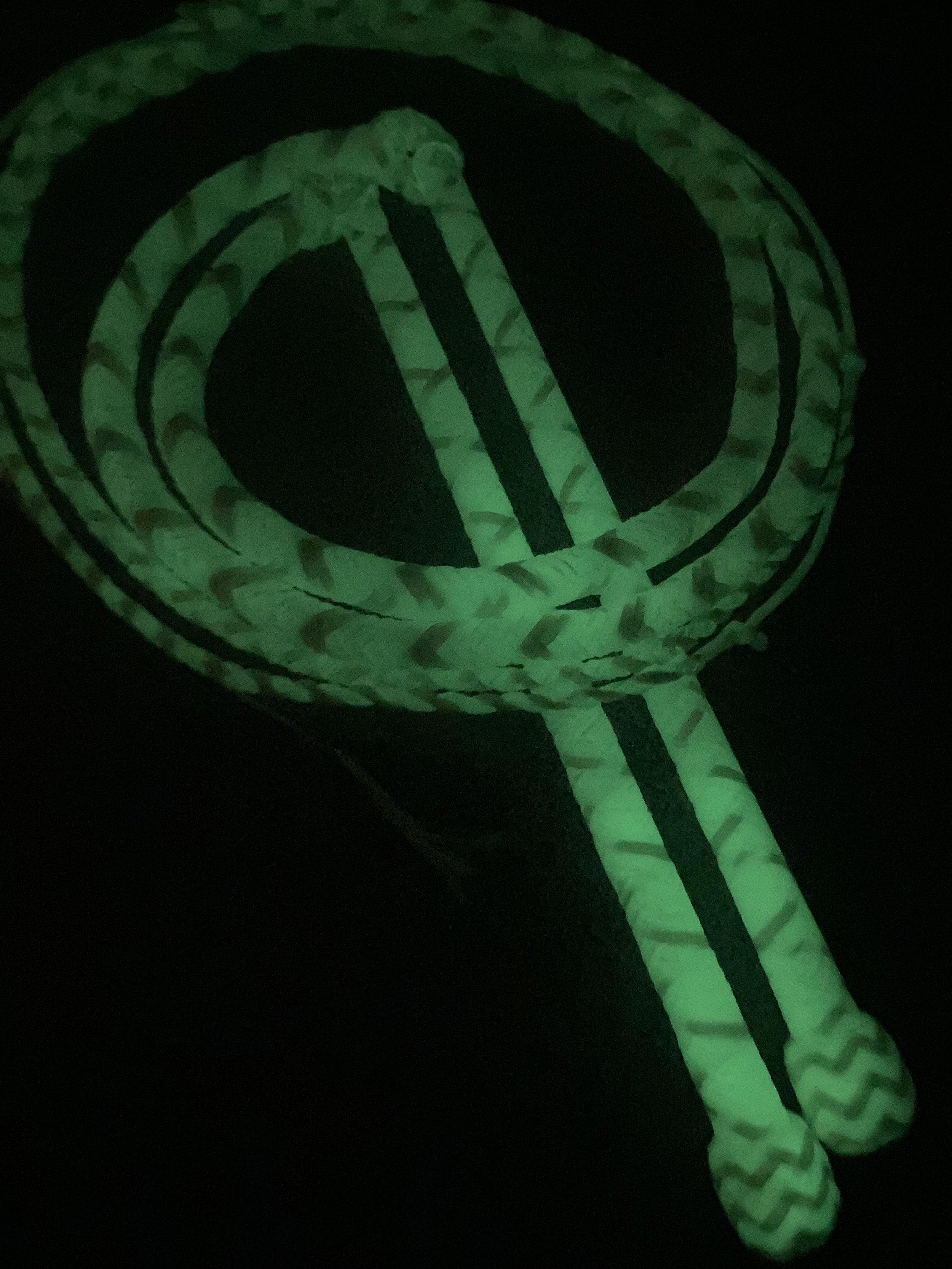 Glow-in-the-dark robe and slippers with a circular design.