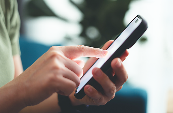 Person using a smartphone with touch screen